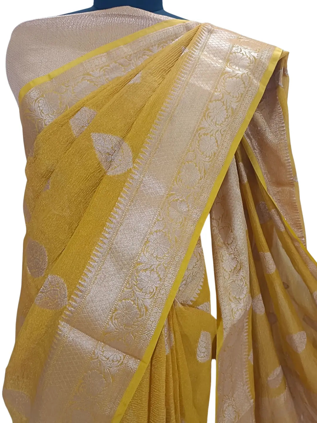 Step into timeless elegance with this stunning Mustard Banarasi Silk Saree