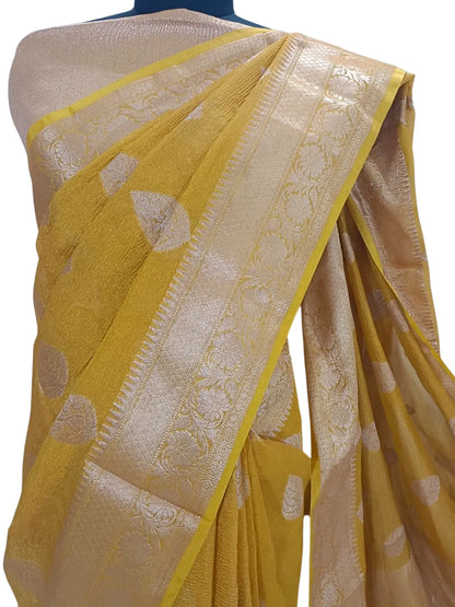 Step into timeless elegance with this stunning Mustard Banarasi Silk Saree